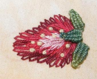 Embroidered strawberry using lazy daisy stitch